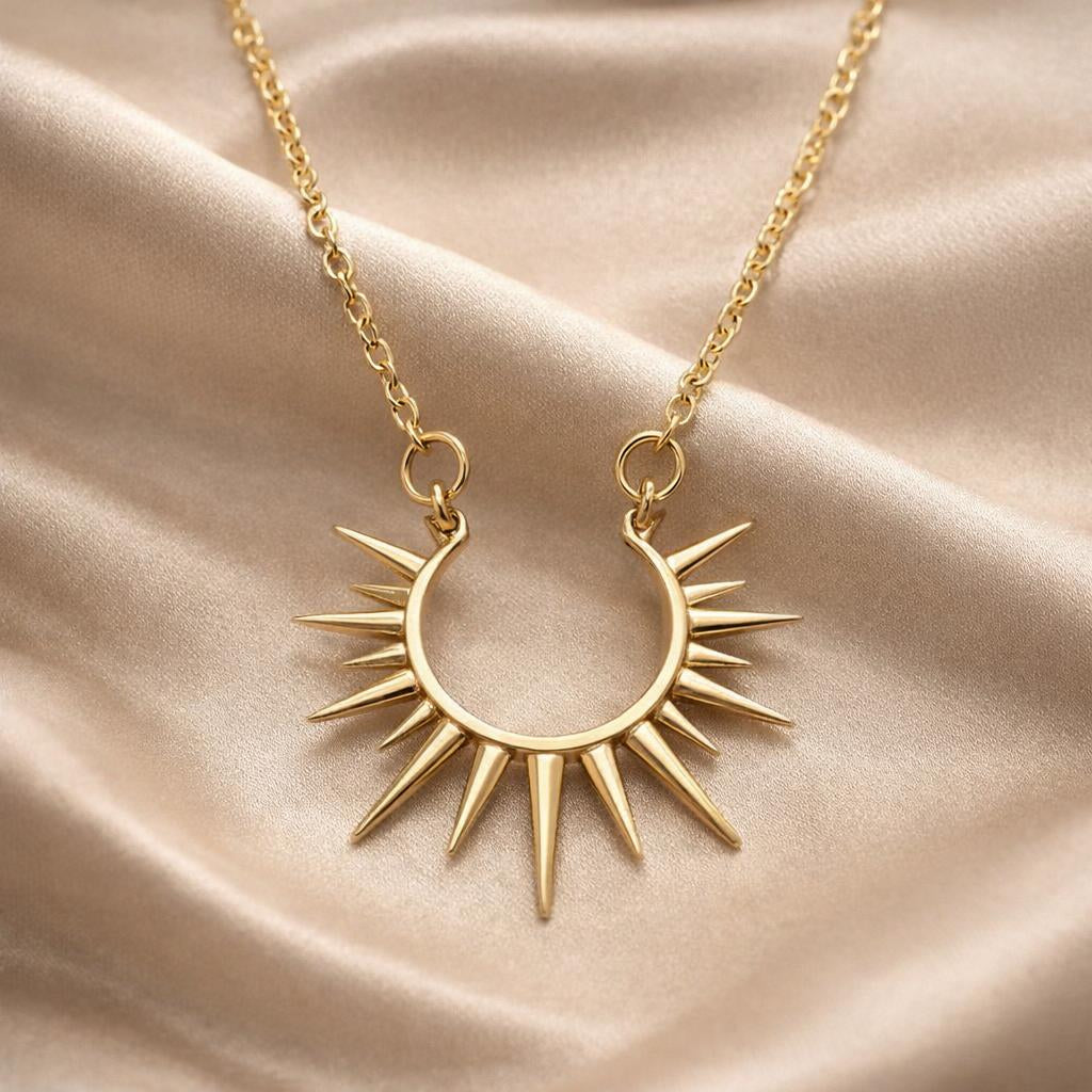 Sun-shaped pendant with white gold chain