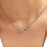 White gold necklace with an infinity pendant and zircon.