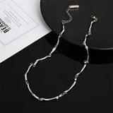 White Gold Necklace with Wave Twist Design