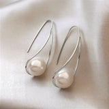 Elegant Earrings with Mysterious Pearl