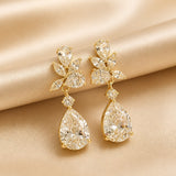 Drop Earrings with Flowers in White Gold