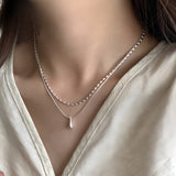 Double Layer Necklace in White Gold with Drop Pendant