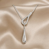 Vintage white gold necklace with a drop-shaped pendant