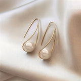 Elegant Earrings with Mysterious Pearl