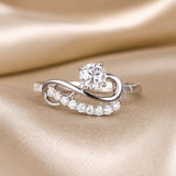 Infinity Wave Ring in Moissanite and White Gold